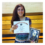 Saige posing with her "Rookie of the Year" award for 10th grade varsity softball.